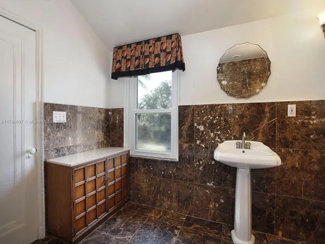 a view of a garden with a large tree