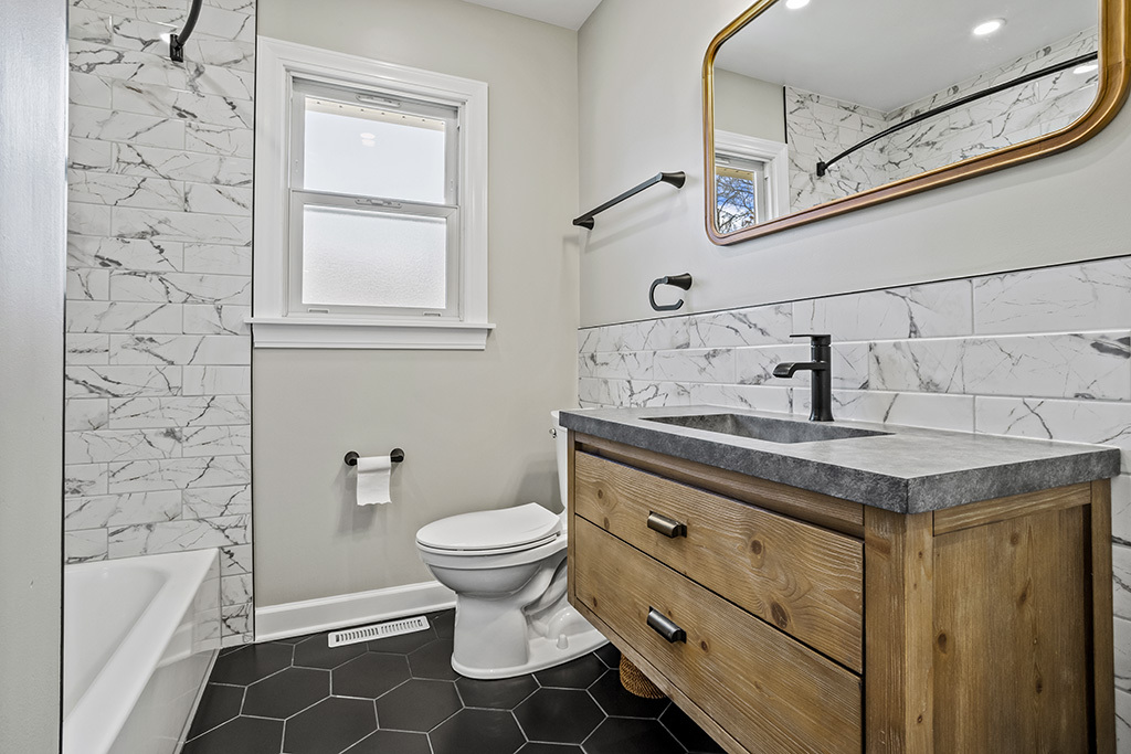 17528 Woodbrook Lane Lockport, IL 60441 - Photo 11 of 17 a bathroom with a sink toilet and shower