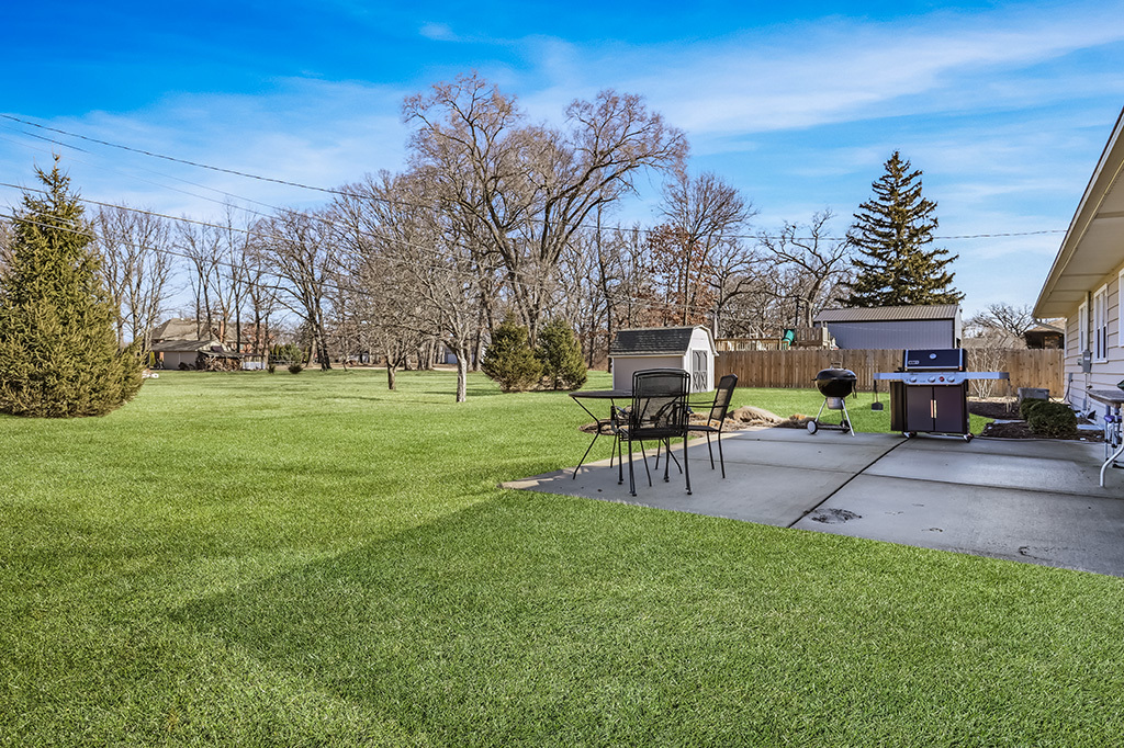 17528 Woodbrook Lane Lockport, IL 60441 - Photo 16 of 17 a view of a house with a backyard porch and sitting area