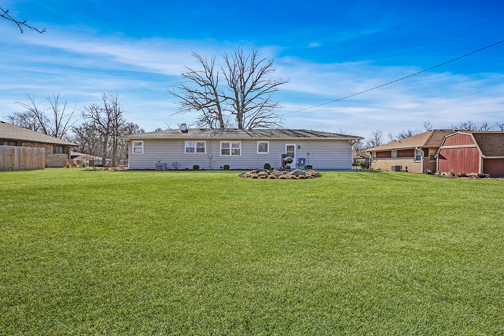 17528 Woodbrook Lane Lockport, IL 60441 - Photo 17 of 17 a view of a house with a big yard and large trees