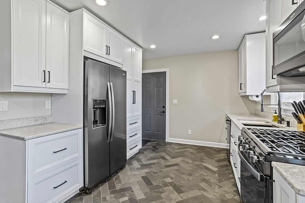 17528 Woodbrook Lane Lockport, IL 60441 - Photo 5 of 17 a kitchen with stainless steel appliances granite countertop a refrigerator and a stove