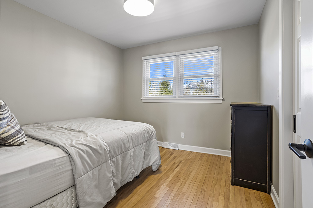 17528 Woodbrook Lane Lockport, IL 60441 - Photo 9 of 17 a bedroom with a bed and a window