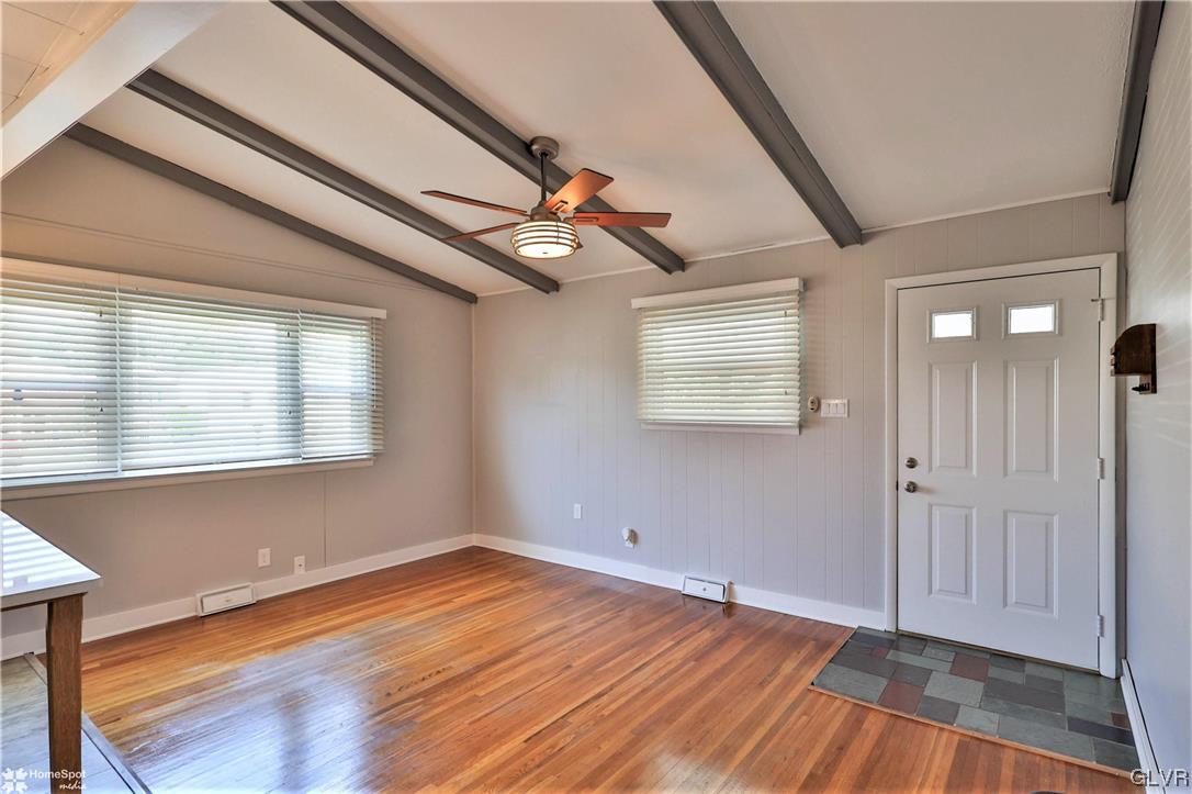 1522 Elayne Street Bethlehem, PA 18017 - Photo 3 of 20 a view of an empty room with wooden floor and a window