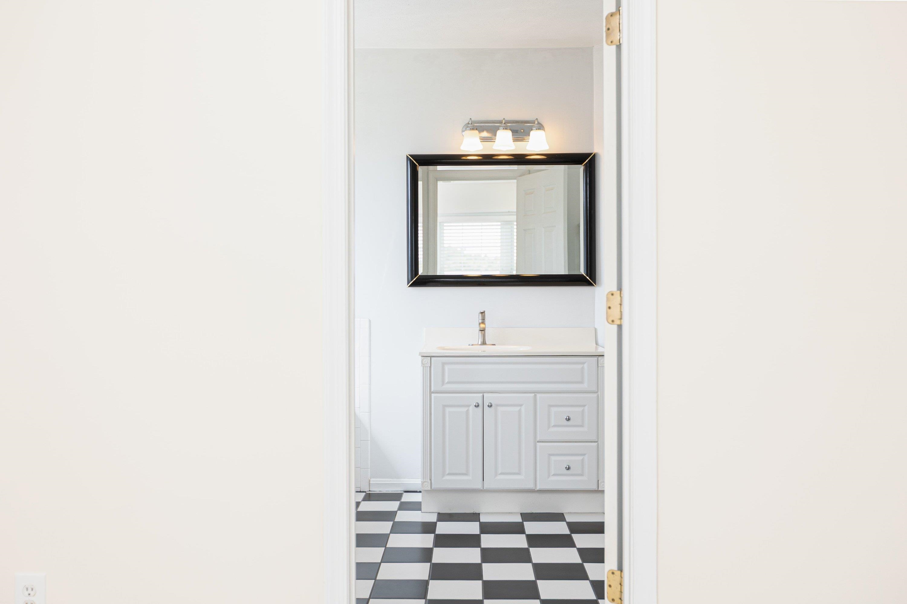 536 Three Leagues Road McGaheysville, VA 22840 - Photo 21 of 71 a bathroom with a sink a mirror and a shower