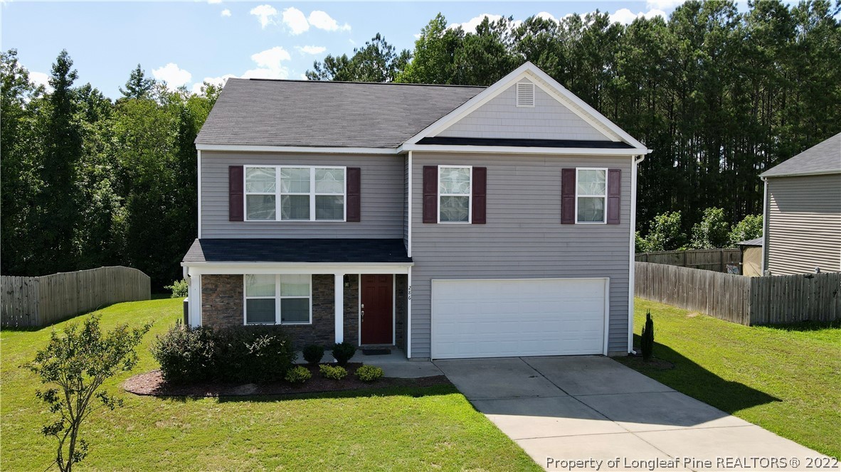 286 Botanical Court Bunnlevel, NC 28323 - Photo 1 of 39 a front view of a house with a yard