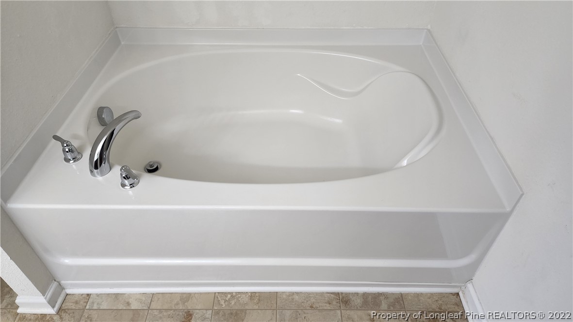 286 Botanical Court Bunnlevel, NC 28323 - Photo 11 of 39 a close up of a bathtub in a bathroom