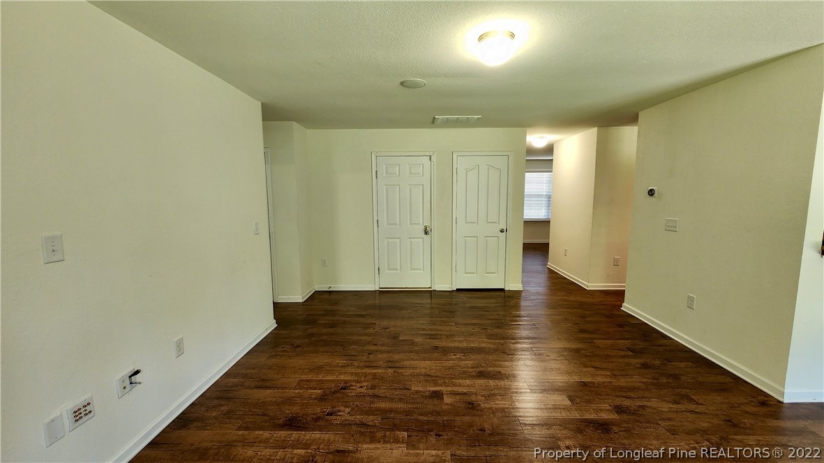 286 Botanical Court Bunnlevel, NC 28323 - Photo 12 of 39 a view of an empty room and wooden floor