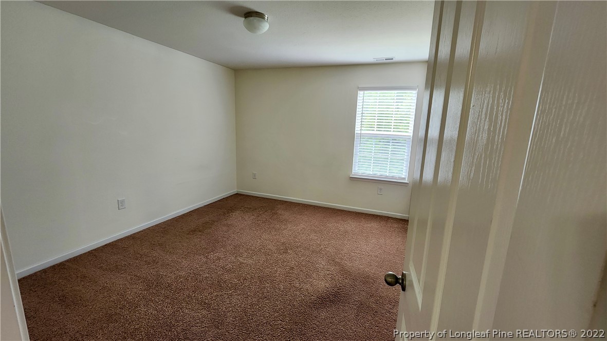286 Botanical Court Bunnlevel, NC 28323 - Photo 16 of 39 a view of an empty room with a window