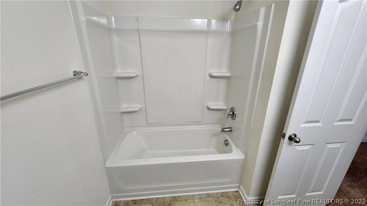 286 Botanical Court Bunnlevel, NC 28323 - Photo 17 of 39 a bathroom with a bathtub and shower