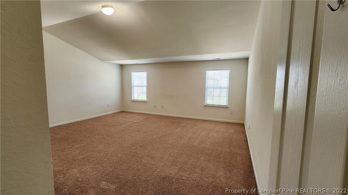 286 Botanical Court Bunnlevel, NC 28323 - Photo 20 of 39 an empty room with windows and closet