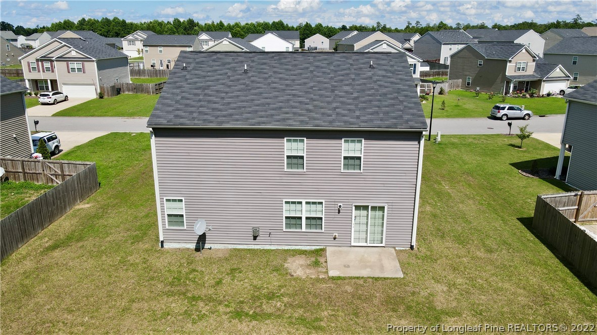 286 Botanical Court Bunnlevel, NC 28323 - Photo 2 of 39 an aerial view of multiple houses with a yard