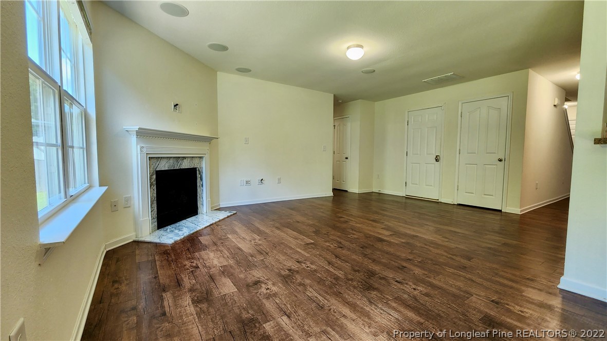 286 Botanical Court Bunnlevel, NC 28323 - Photo 38 of 39 a view of empty room with wooden floor and fan