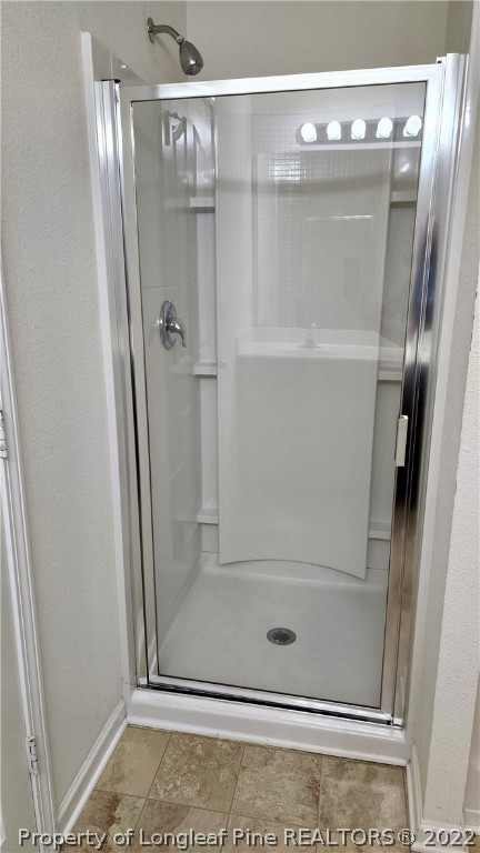 286 Botanical Court Bunnlevel, NC 28323 - Photo 39 of 39 a bathroom with a glass shower door