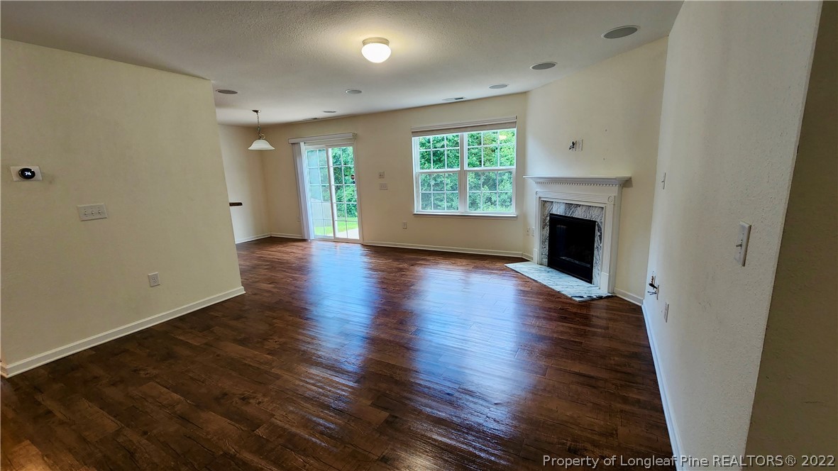286 Botanical Court Bunnlevel, NC 28323 - Photo 6 of 39 an empty room with wooden floor and a window