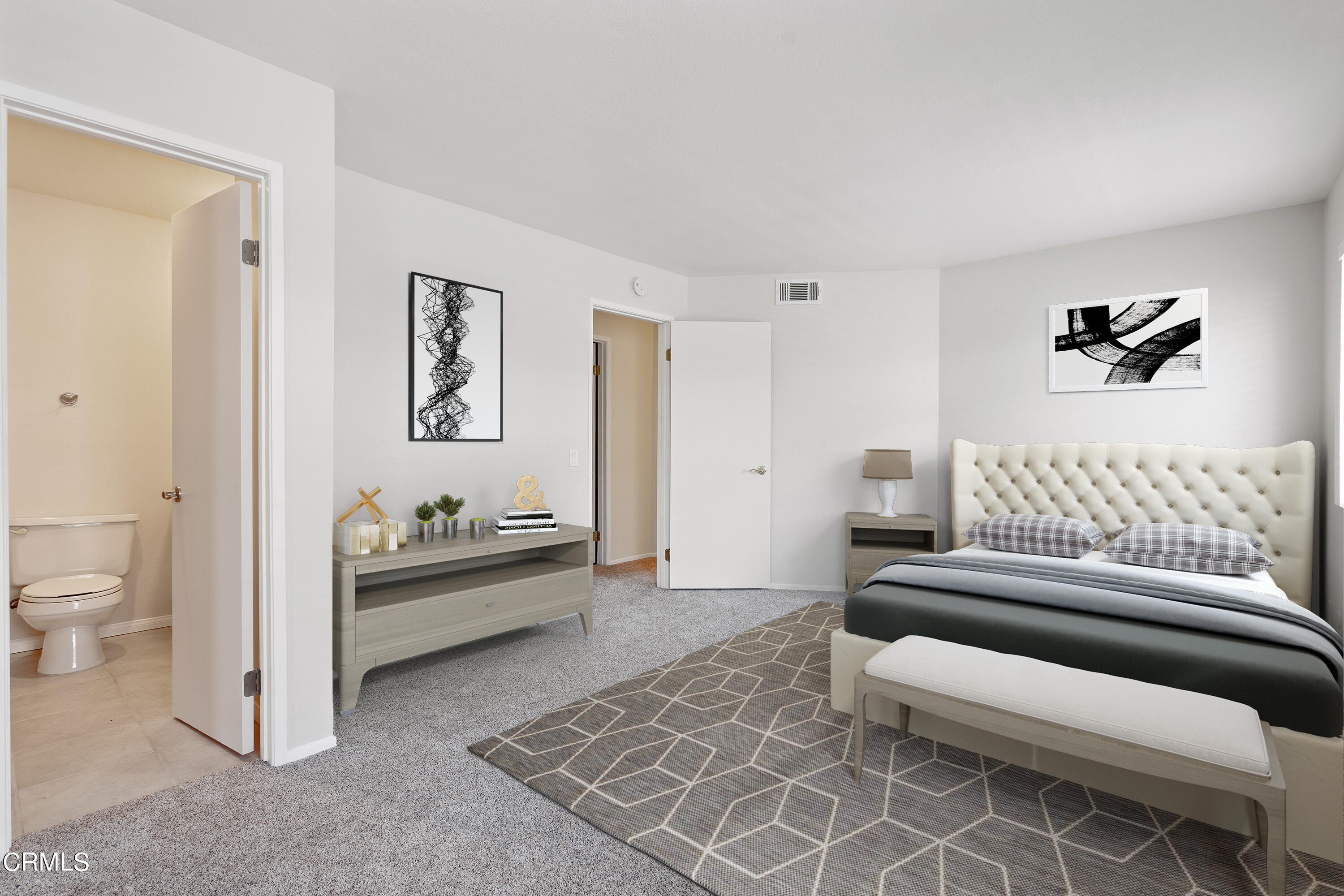 510 Spring Road, Unit 118 Moorpark, CA 93021 - Photo 8 of 24 a bedroom with furniture and a rug
