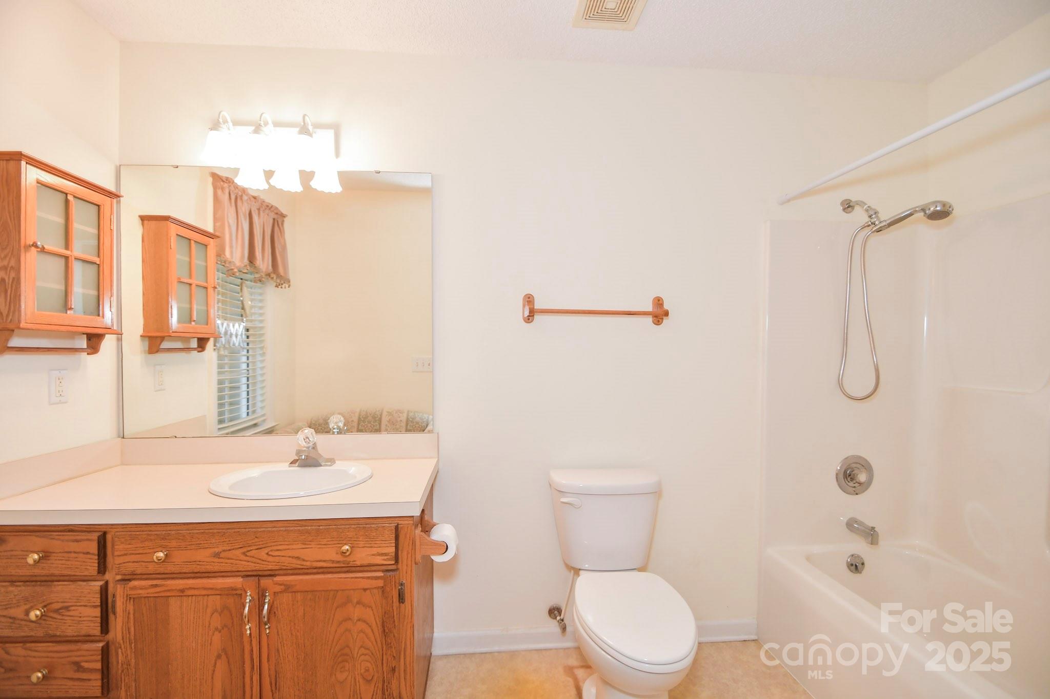 2718 Goldmine Road Monroe, NC 28110 - Photo 24 of 25 a bathroom with a sink a toilet and shower