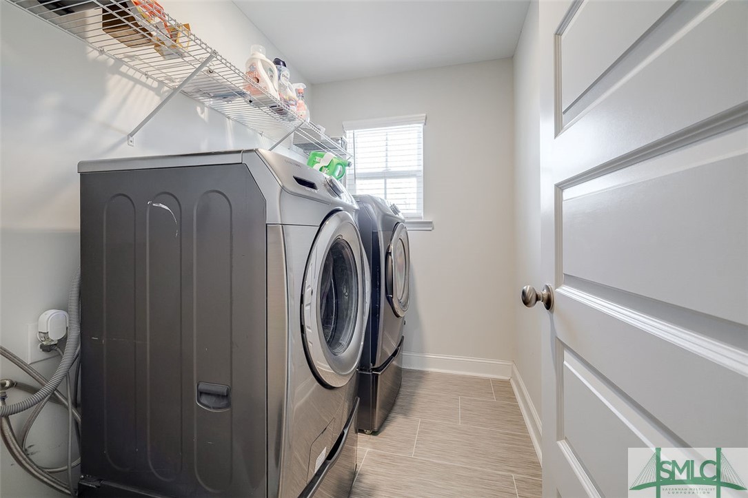 55 Saddlebrush Road Ellabell, GA 31308 - Photo 43 of 50 Upstairs laundry room with front loading washer an