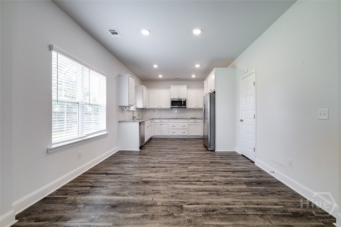 55 Saddlebrush Road Ellabell, GA 31308 - Photo 6 of 50 Currently vacant - Dining area with kitchen beyond