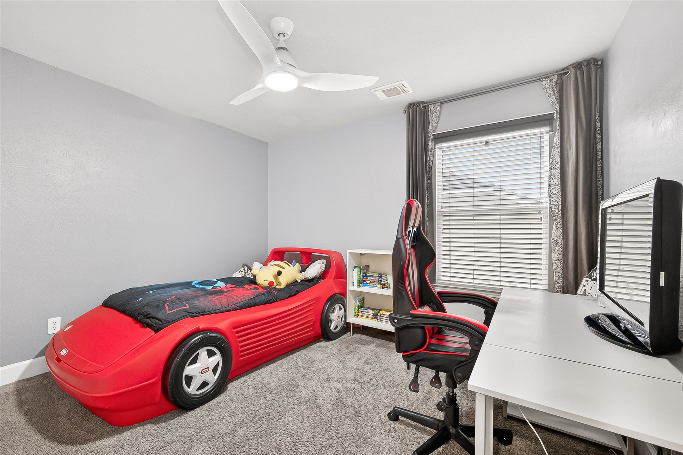 7415 Riven Oaks Court Cypress, TX 77433 - Photo 36 of 42 This generously sized secondary bedroom offers a ceiling fan and versatile space ideal for a bedroom, guest room, or home office.