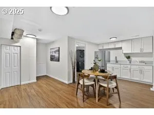 a view of a dining room with furniture and wooden floor