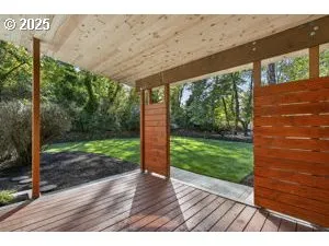 a view of a porch with wooden floor