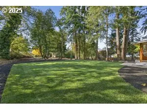 a backyard of a house with lots of green space