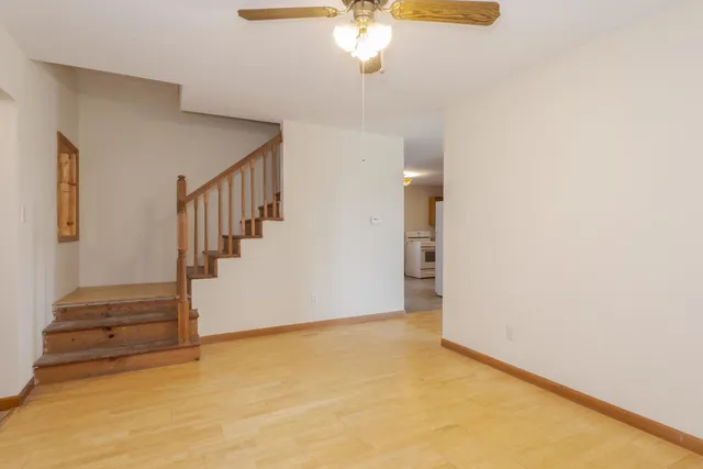 a kitchen with granite countertop cabinets stainless steel appliances a sink and a window