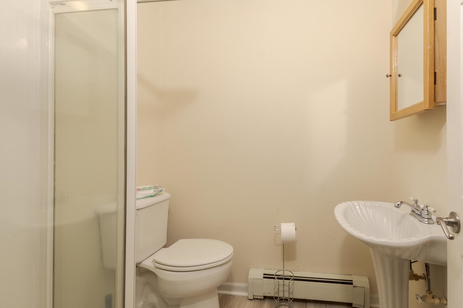 22998 East 2800 N Road Odell, IL 60460 - Photo 32 of 46 a bathroom with a toilet a sink and mirror