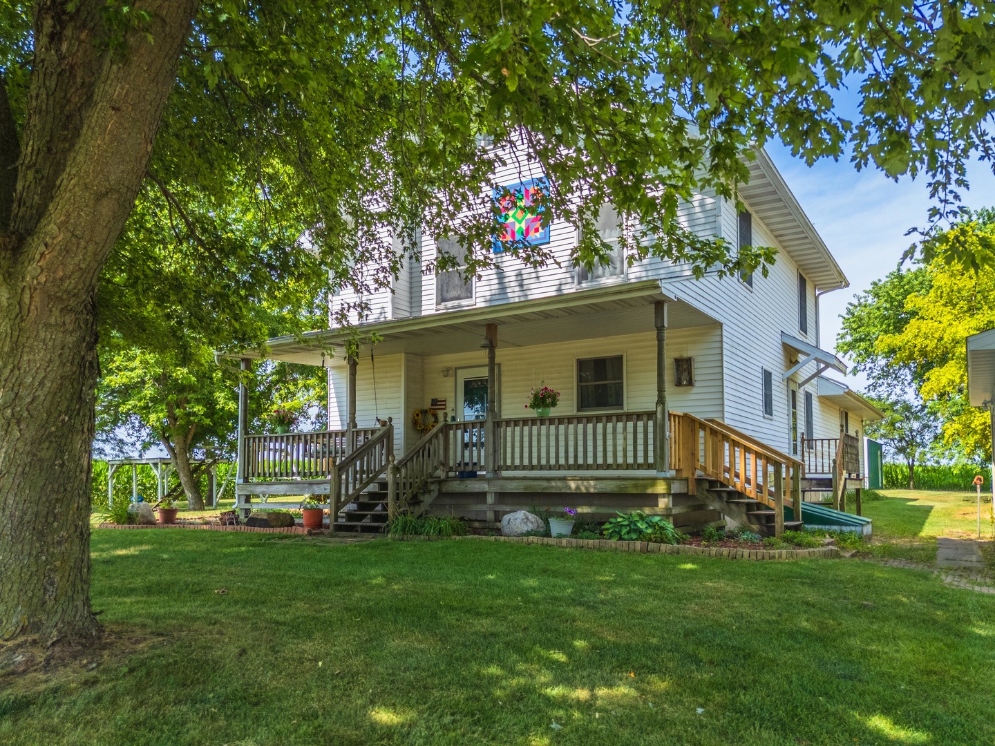 22998 East 2800 N Road Odell, IL 60460 - Photo 4 of 46 a front view of a house with a garden