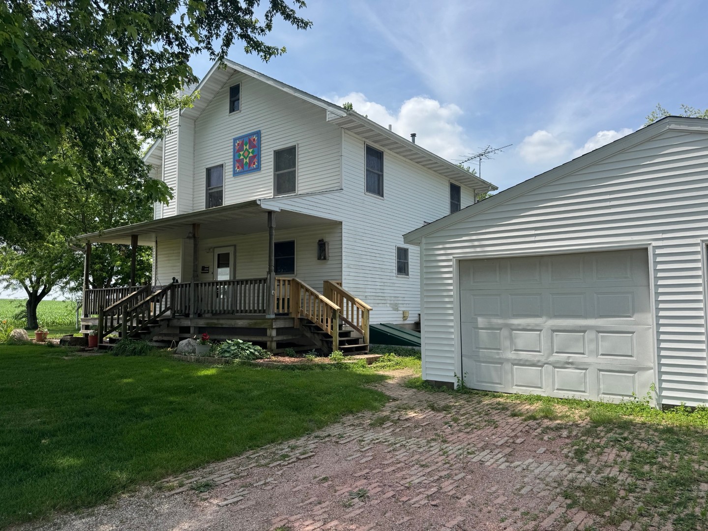22998 East 2800 N Road Odell, IL 60460 - Photo 6 of 46 a front view of a house with a yard and garage