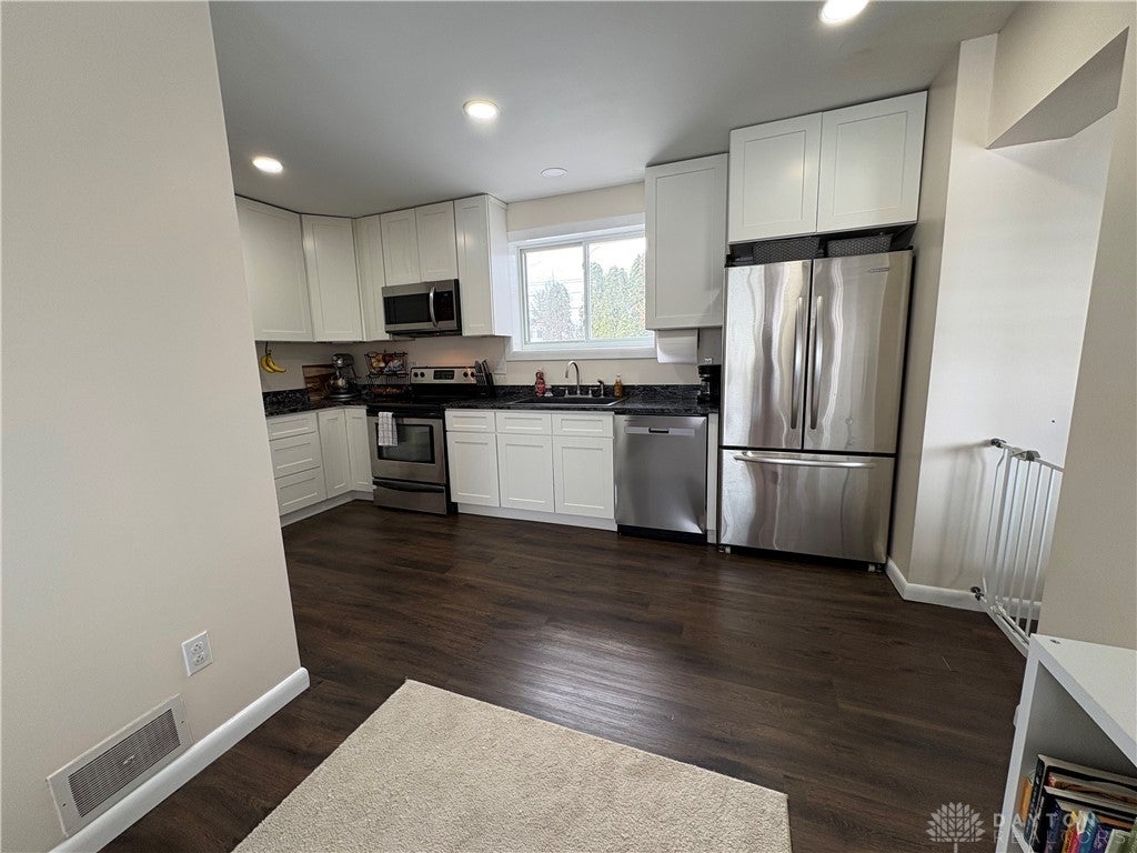 1513 Ridgeway Drive Springfield, OH 45506 - Photo 19 of 53 This kitchen showcases ample cabinet space and modern stainless steel appliances.