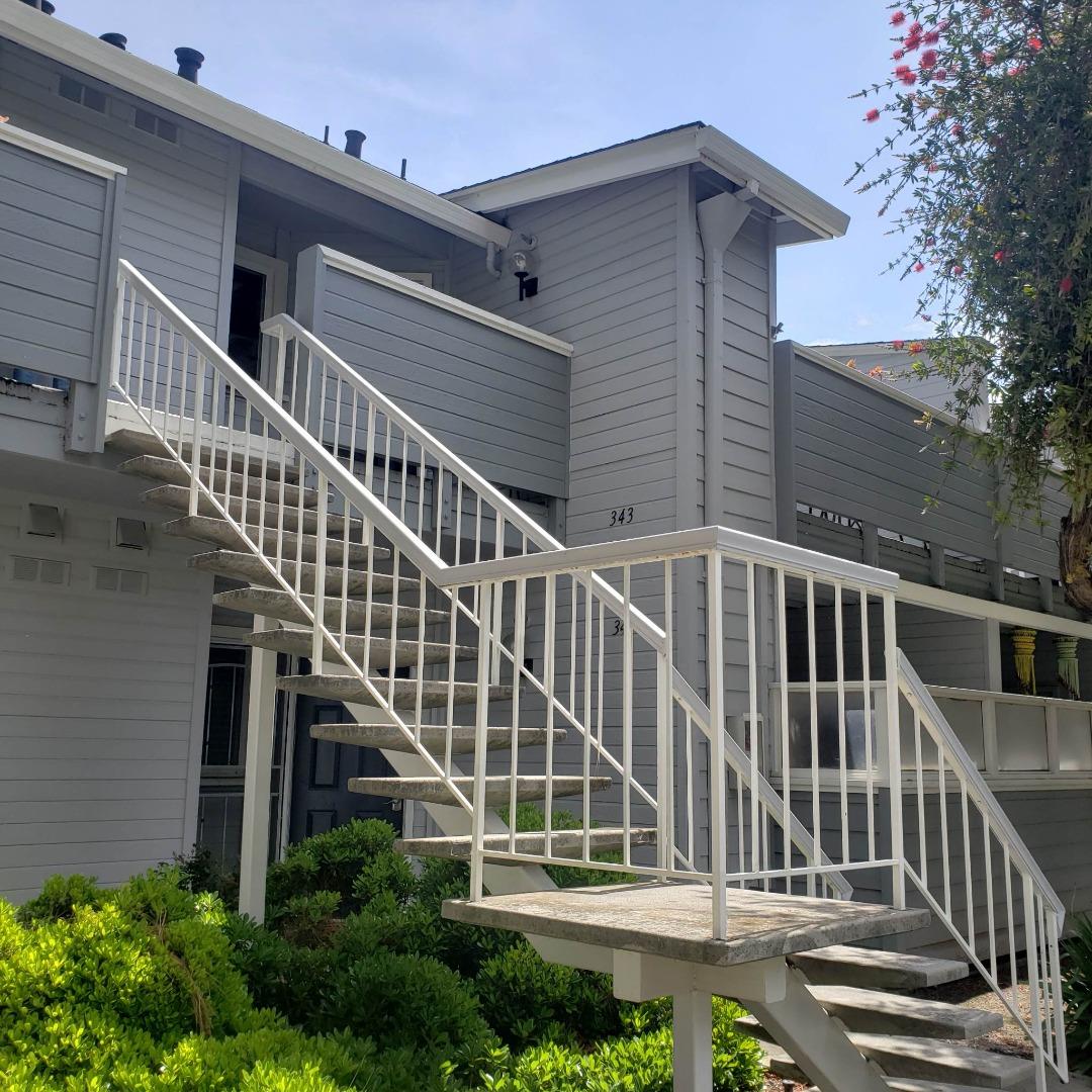 a balcony view with staircase