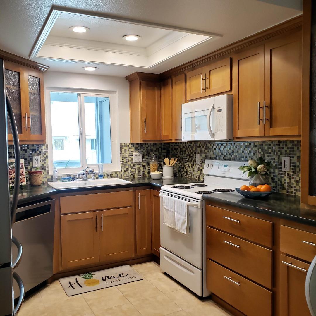 343 Shadow Run Drive San Jose, CA 95110 - Photo 2 of 17 a kitchen with a sink stove and cabinets
