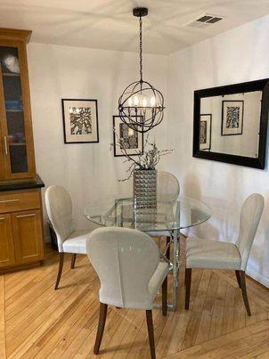 343 Shadow Run Drive San Jose, CA 95110 - Photo 3 of 17 a view of a dining room with furniture wooden floor and chandelier