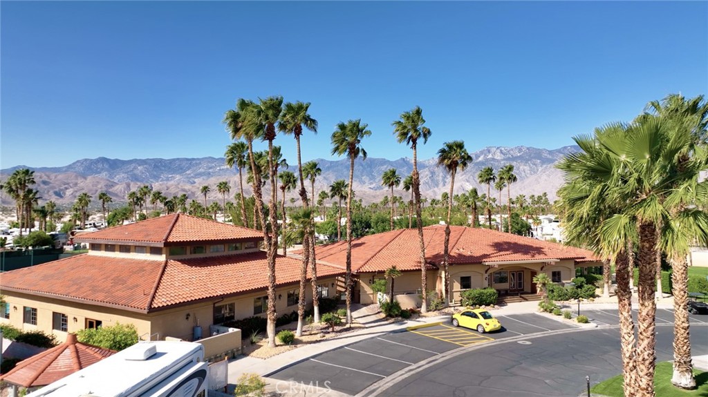 69801 Ramon Road, Unit 57 Cathedral City, CA 92234 - Photo 34 of 47 an outdoor space with patio and umbrellas