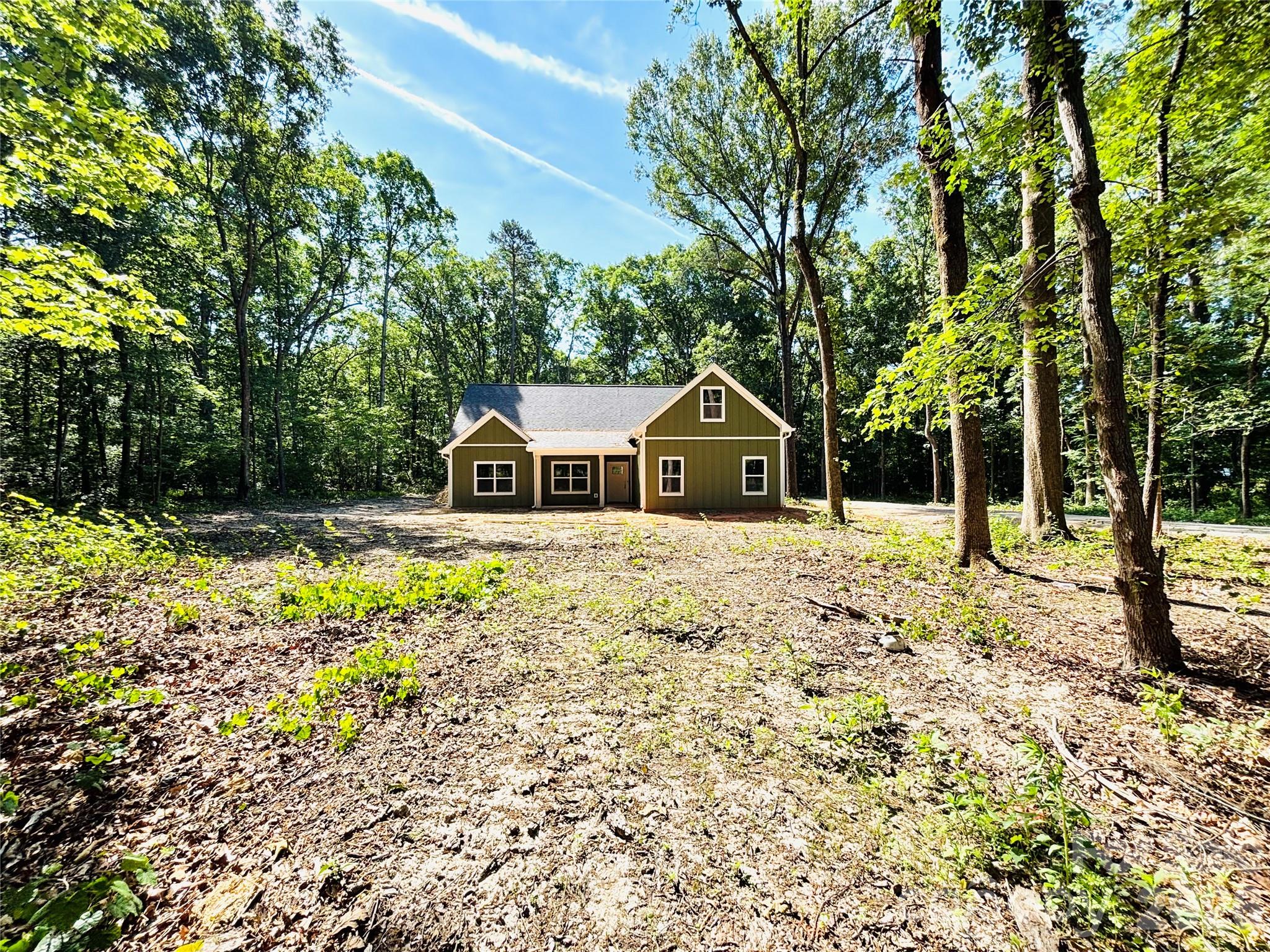 1818 New Salem Road Monroe, NC 28110 - Photo 1 of 8 a front view of a house with a yard
