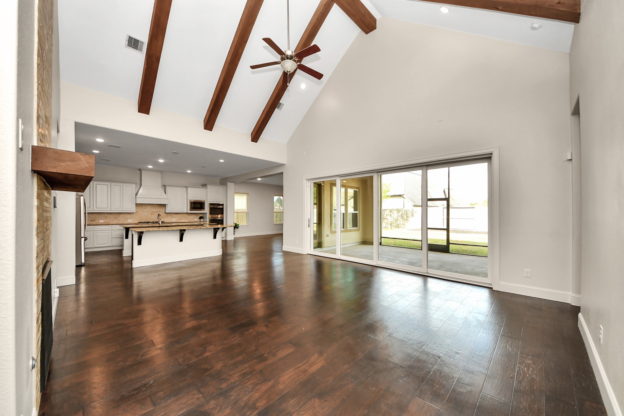 9814 Carver Drive Rosharon, TX 77583 - Photo 5 of 34 20 ft vaulted ceiling with wood beams.