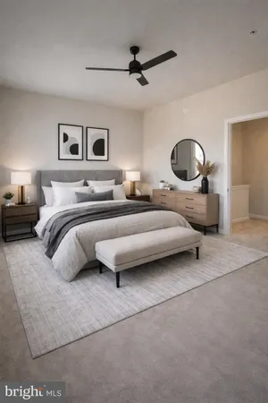 a bedroom with a bed a lamp and a ceiling fan