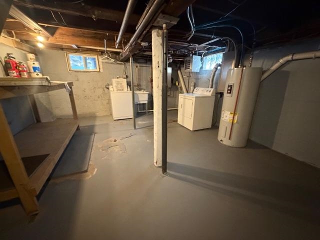 824 12th Street North Virginia, MN 55792 - Photo 31 of 34 Below grade area with water heater and washer and clothes dryer