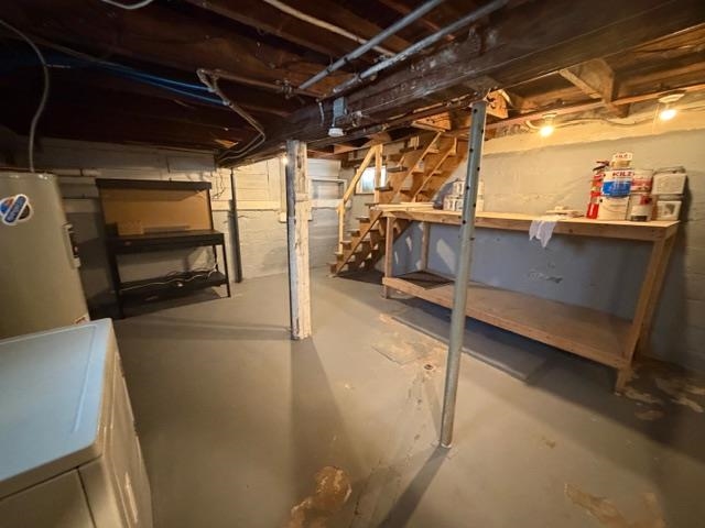 824 12th Street North Virginia, MN 55792 - Photo 33 of 34 Unfinished basement featuring stairway and water heater