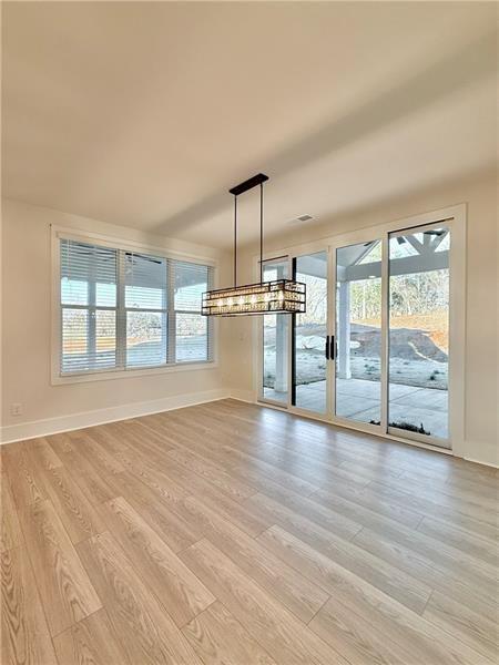 122 Palisade Drive Rydal, GA 30171 - Photo 22 of 54 wooden floor in an empty room with a window