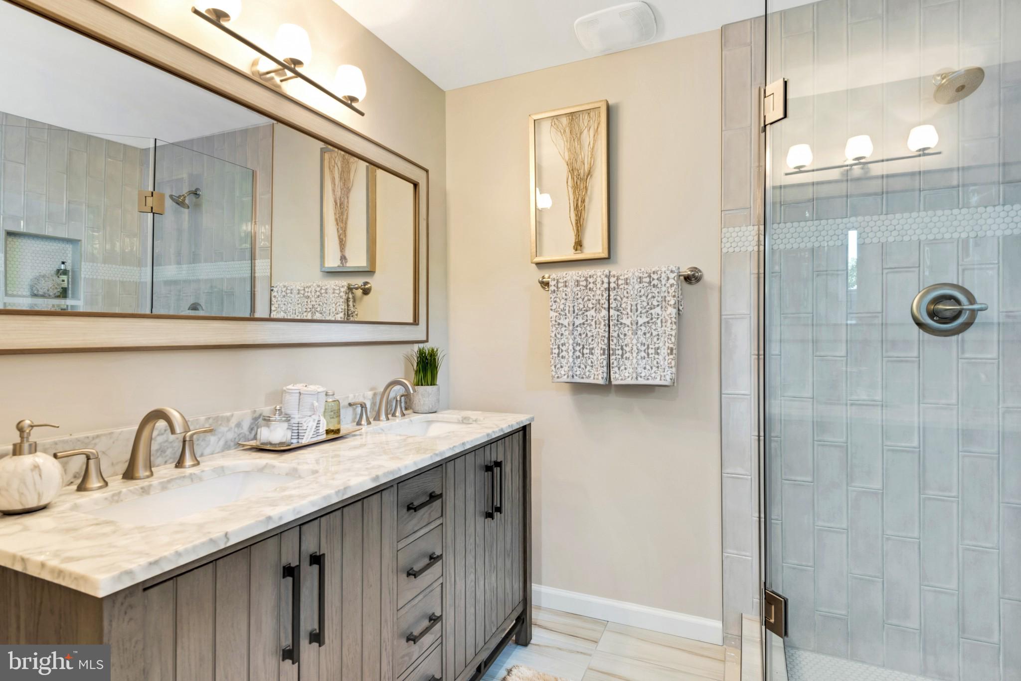 8211 Anita Road Baltimore, MD 21208 - Photo 22 of 31 Double vanity sinks, custom tile in the shower