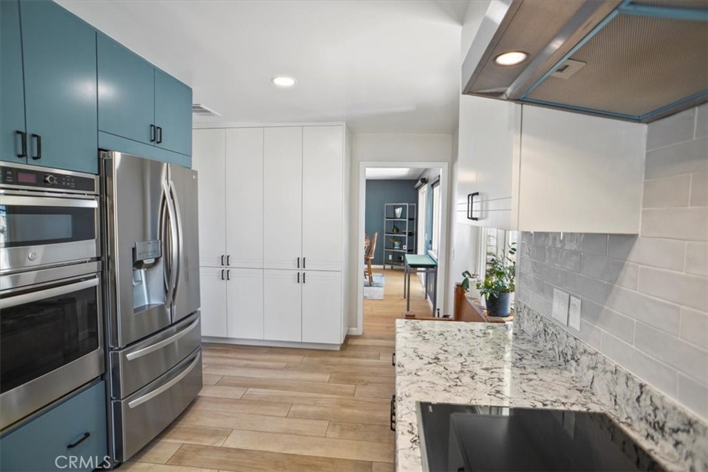 27811 Jubilee Run Road Pearblossom, CA 93553 - Photo 12 of 27 a kitchen with stainless steel appliances granite countertop a refrigerator and a sink