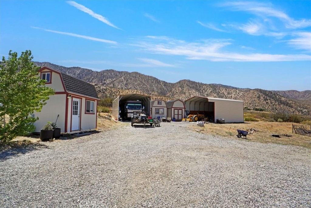 27811 Jubilee Run Road Pearblossom, CA 93553 - Photo 20 of 27 a view of a house with a snow in the yard
