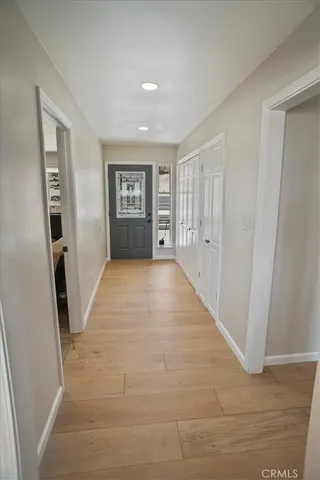 a view of a big room with closet and windows