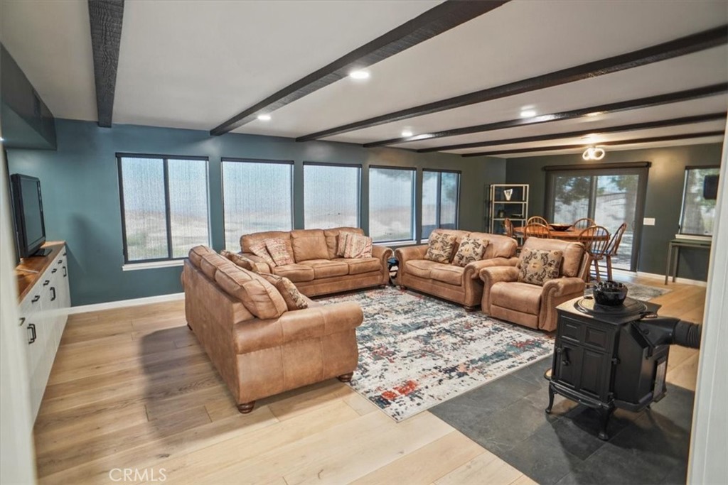 27811 Jubilee Run Road Pearblossom, CA 93553 - Photo 6 of 27 a living room with furniture and a large window