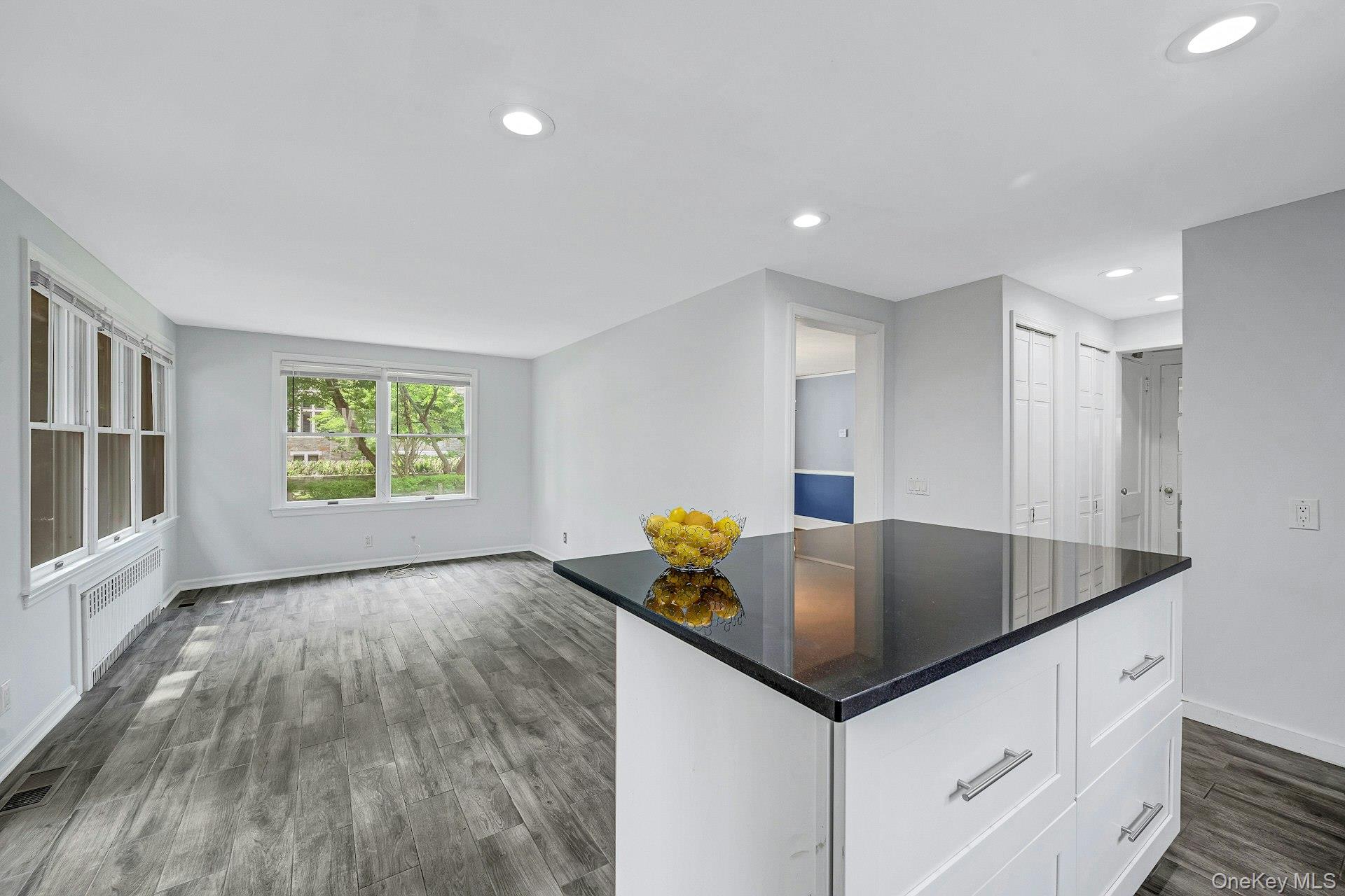 10 Carman Road Scarsdale, NY 10583 - Photo 11 of 32 Kitchen with center island and stainless appliances and doors to yard