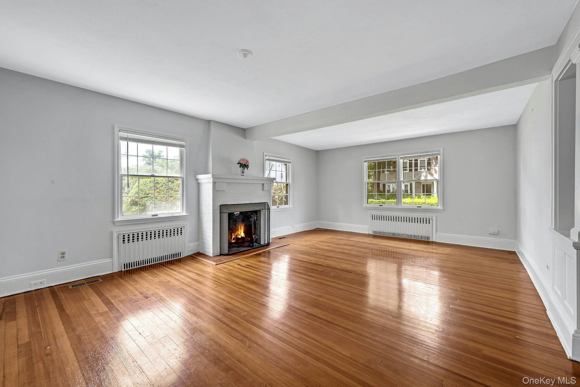 10 Carman Road Scarsdale, NY 10583 - Photo 4 of 32 Spacious Living Room with fireplace