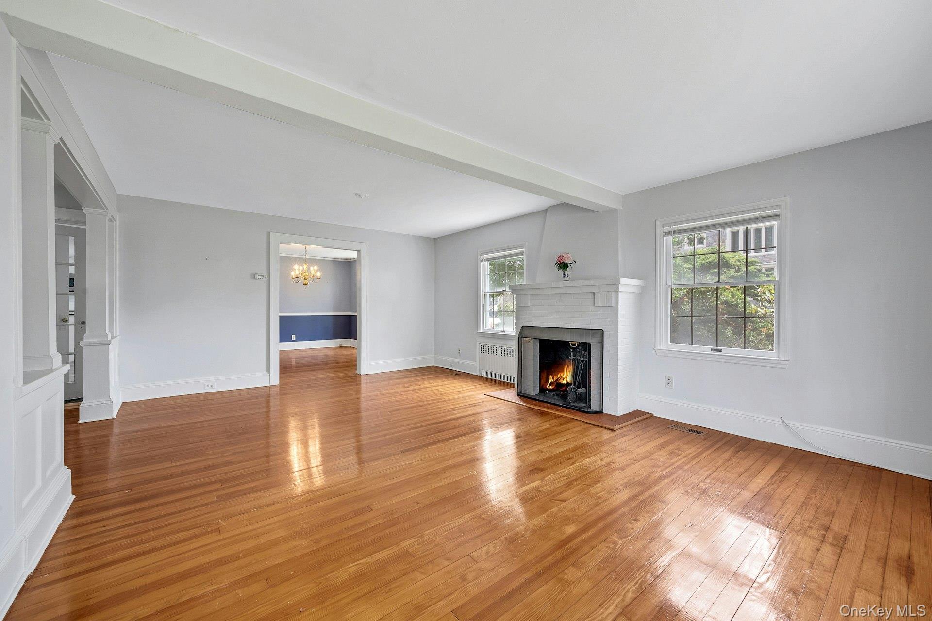 10 Carman Road Scarsdale, NY 10583 - Photo 6 of 32 Spacious Living Room with fireplace