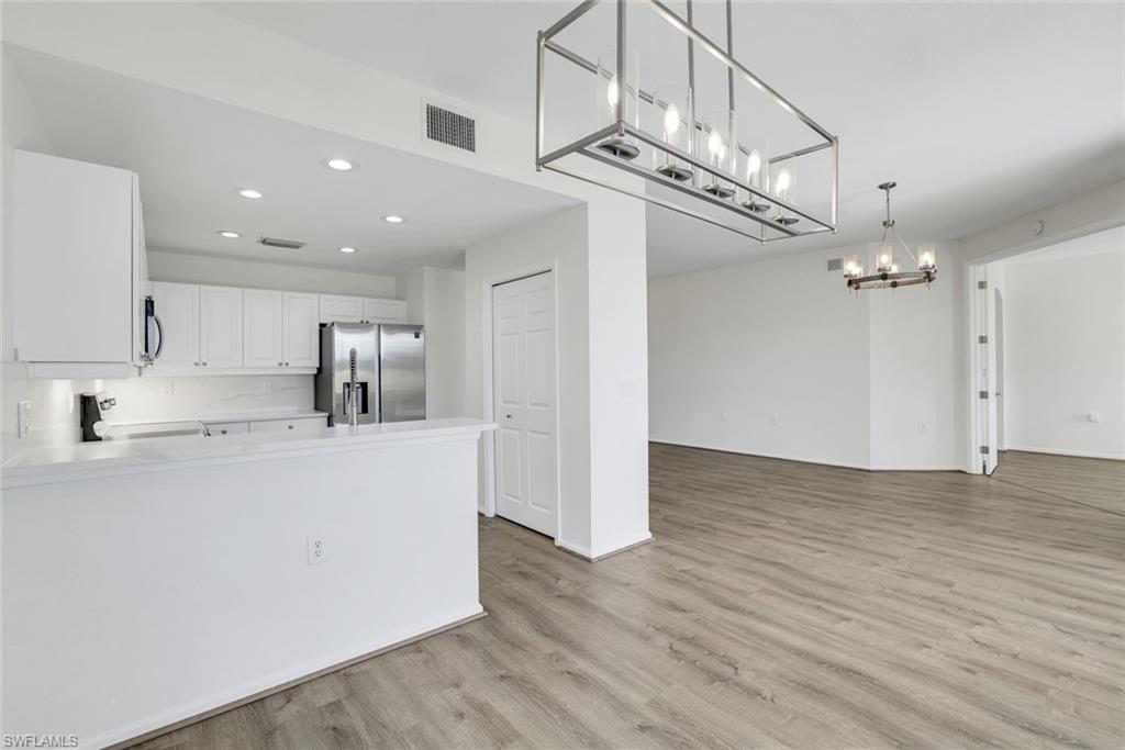 6875 Ascot Drive, Unit 6 Naples, FL 34113 - Photo 12 of 31 a view of kitchen with refrigerator and window